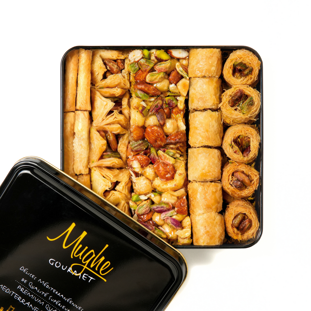 Mughe Gourmet Luxury Turkish Baklava assortment tin, a premium holiday gift idea. Unique gourmet food gift idea: Mughe Baklava, featuring a variety of bite-sized treats in a stylish tin, ready for corporate events or holiday delivery.